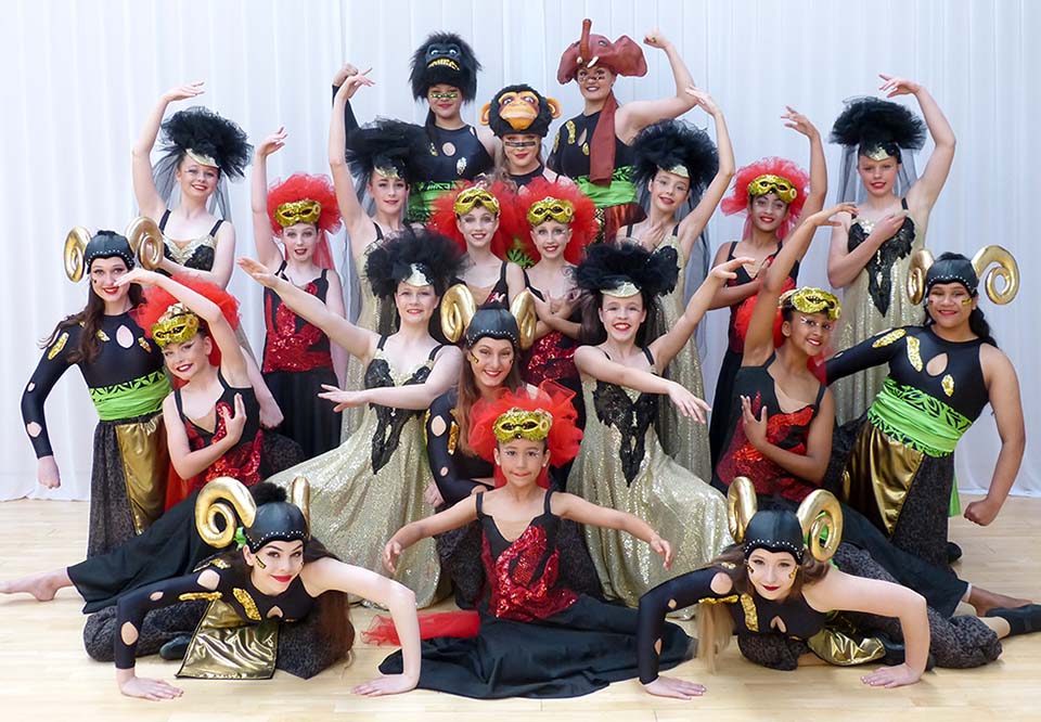 Group photo of VCM Academy students in annual recital costumes