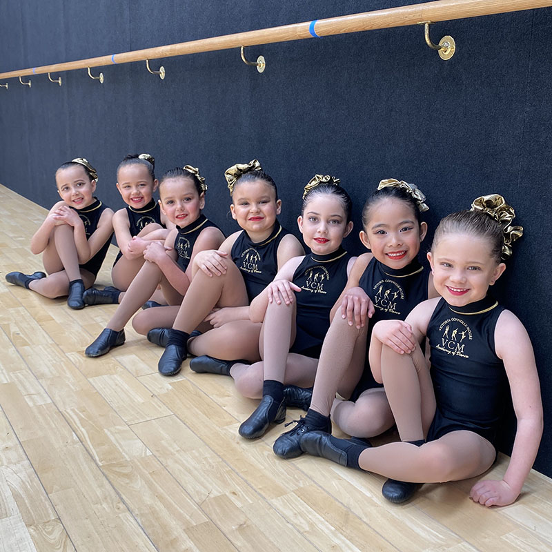 junior jazz dance students sitting together at a leading dance academy